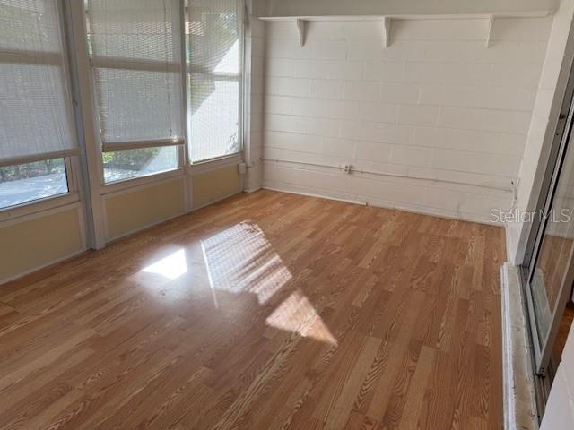 unfurnished dining area with hardwood / wood-style flooring