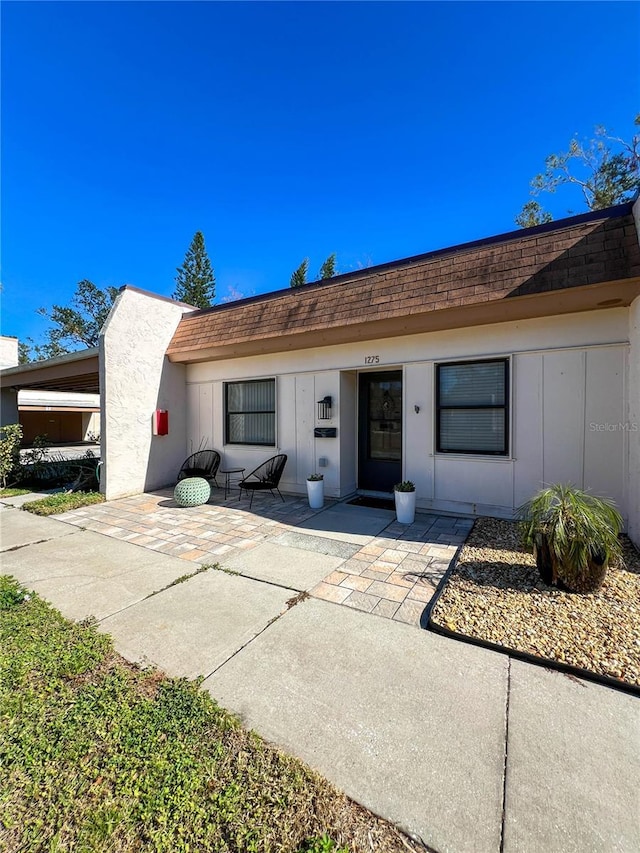 ranch-style house featuring a patio