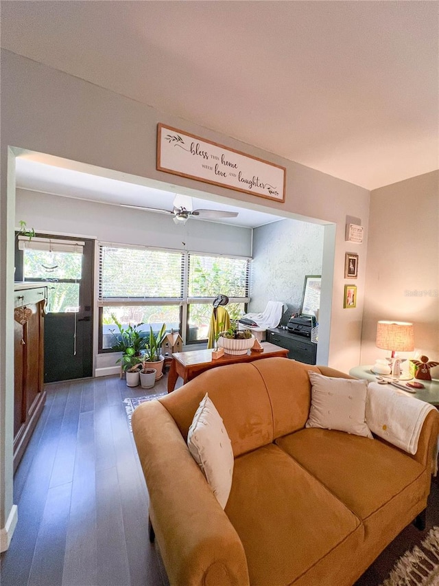 living room with a wealth of natural light, ceiling fan, and hardwood / wood-style flooring