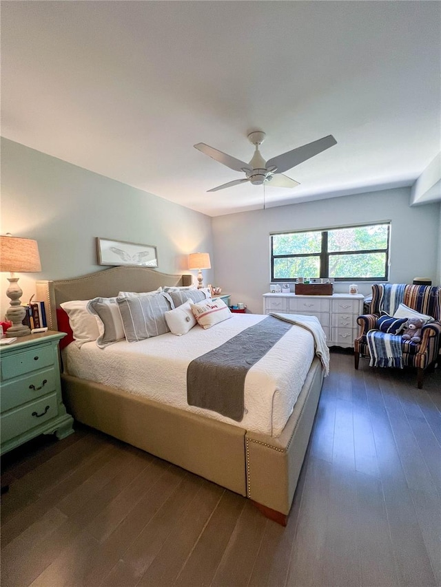 bedroom featuring dark hardwood / wood-style floors and ceiling fan