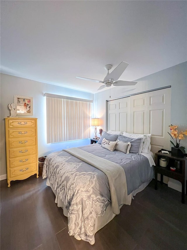 bedroom featuring ceiling fan and dark hardwood / wood-style flooring