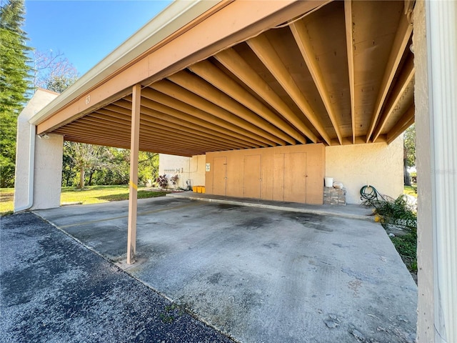 view of parking with a carport