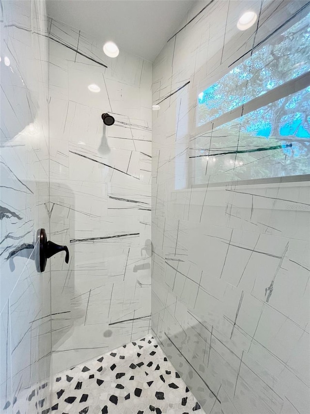 bathroom with tiled shower