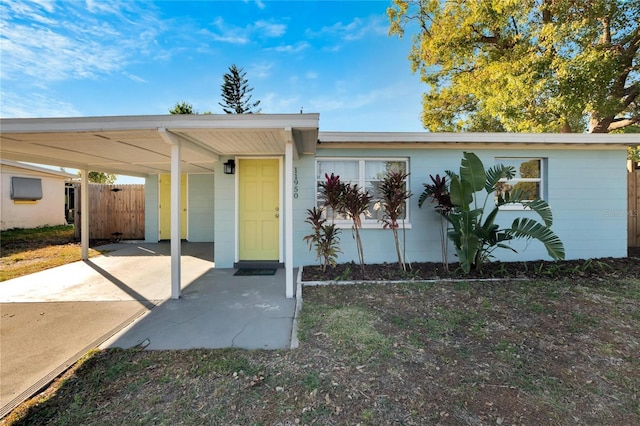 single story home featuring a carport