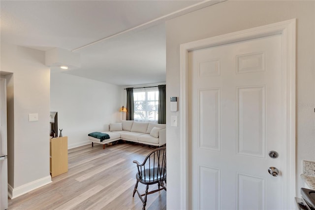 living room with light hardwood / wood-style flooring