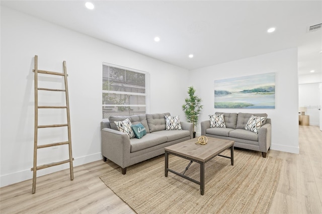 living room with light hardwood / wood-style floors