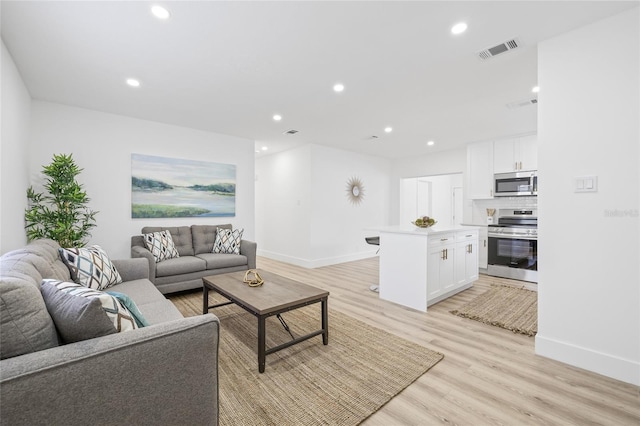 living room featuring light hardwood / wood-style flooring