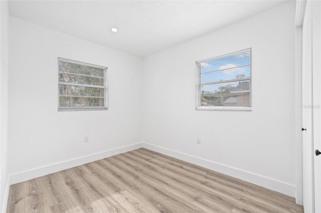 unfurnished room featuring light hardwood / wood-style floors