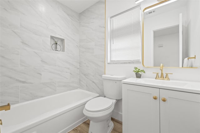 bathroom featuring wood-type flooring, vanity, and toilet