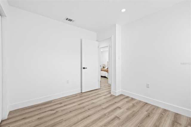 unfurnished room with light hardwood / wood-style floors