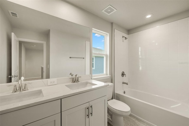 full bathroom with vanity, bathing tub / shower combination, and toilet