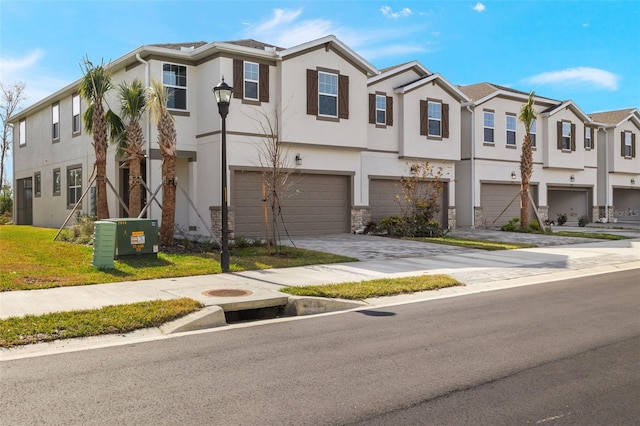 townhome / multi-family property featuring cooling unit and a garage