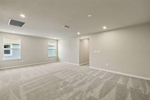 empty room featuring light colored carpet