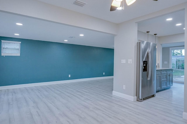 interior space featuring ceiling fan and light hardwood / wood-style floors