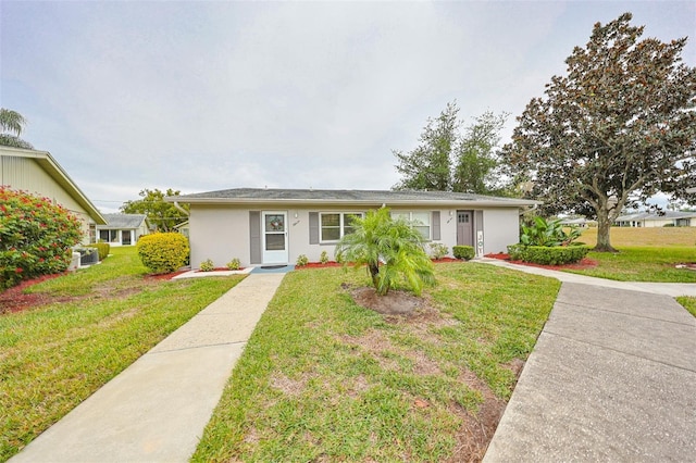 ranch-style house featuring a front lawn