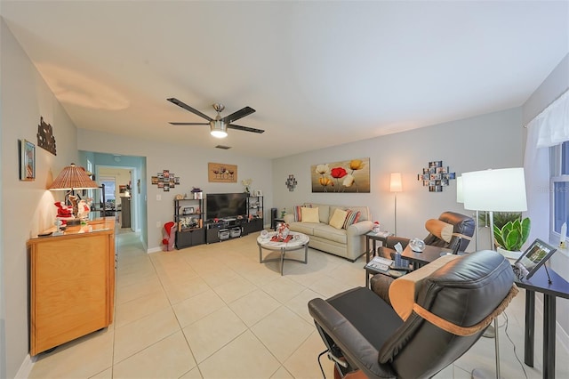 living room with ceiling fan and light tile patterned flooring