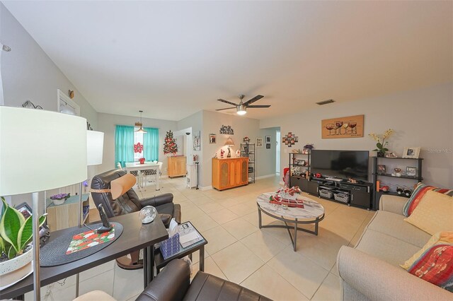 tiled living room with ceiling fan