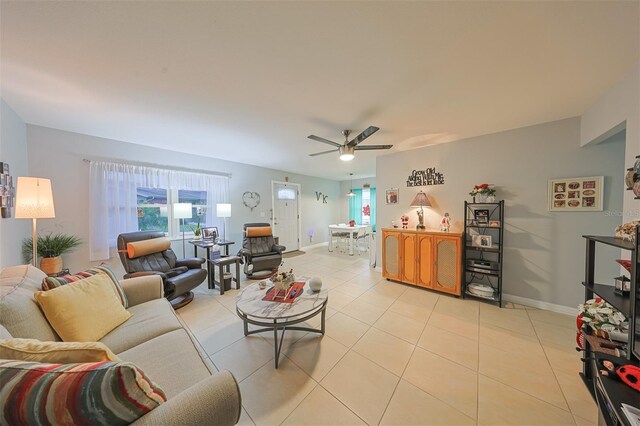 tiled living room with ceiling fan