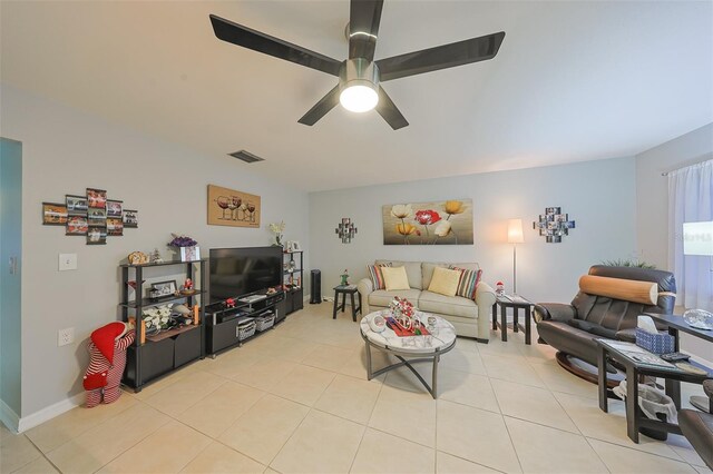 living room with ceiling fan and light tile patterned floors