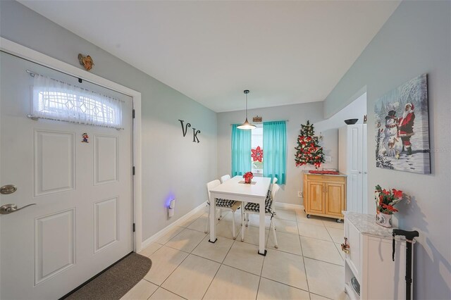 dining area featuring light tile patterned flooring