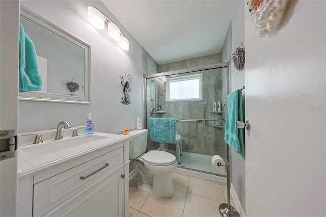 bathroom featuring toilet, vanity, tile patterned floors, and walk in shower