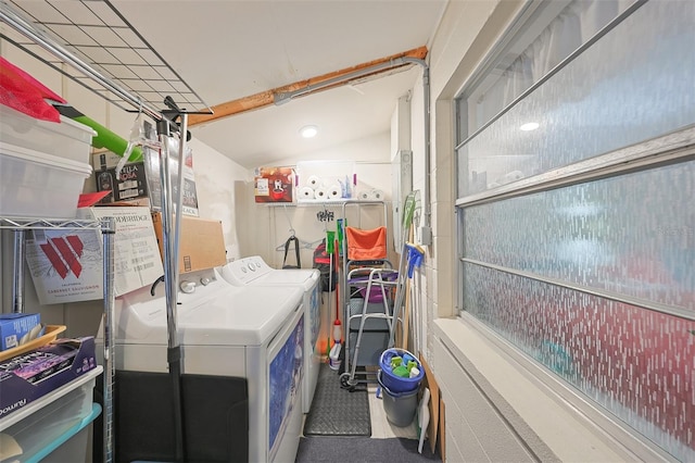 clothes washing area featuring washer and clothes dryer