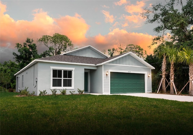 view of front of house with a lawn and a garage