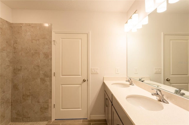 20118 Quesada Ave, Port Charlotte, FL 33952 - bathroom featuring double vanity, baseboards, and tiled shower