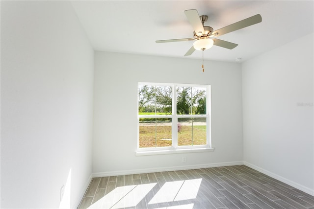 empty room featuring hardwood / wood-style flooring and ceiling fan