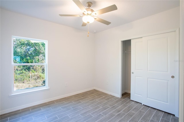 20118 Quesada Ave, Port Charlotte, FL 33952 - unfurnished bedroom featuring baseboards, a closet, wood finished floors, and ceiling fan