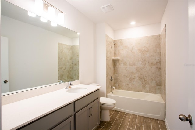 20118 Quesada Ave, Port Charlotte, FL 33952 - full bathroom with toilet, vanity, bathtub / shower combination, and wood tiled floors
