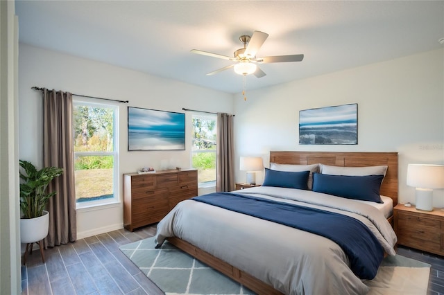 20118 Quesada Ave, Port Charlotte, FL 33952 - bedroom with multiple windows, wood finished floors, baseboards, and a ceiling fan