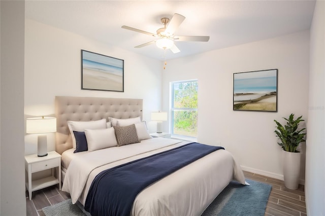 bedroom featuring ceiling fan and dark wood-type flooring