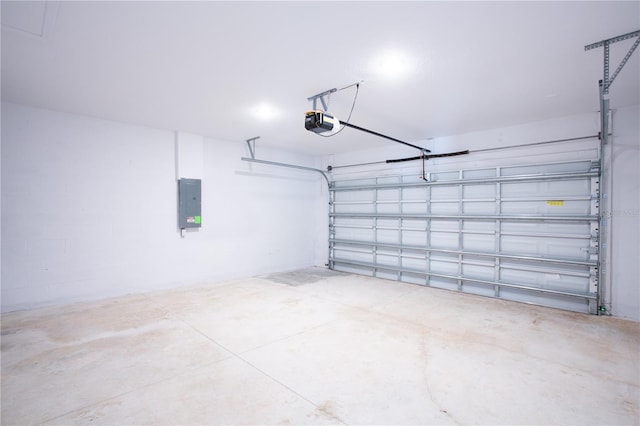 garage with electric panel and a garage door opener