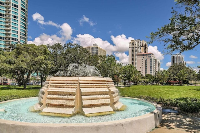 surrounding community featuring a city view and a yard