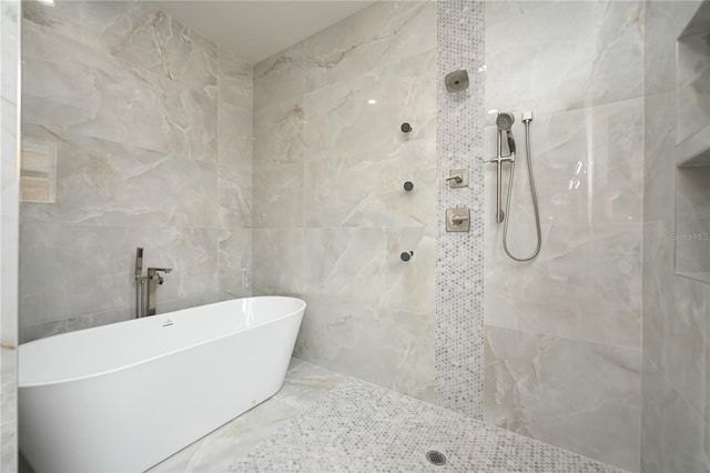 bathroom featuring separate shower and tub