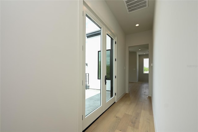 hallway featuring light hardwood / wood-style floors