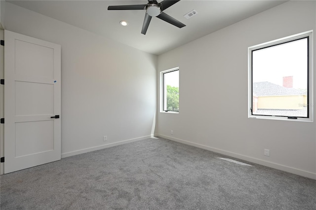 empty room with light carpet and ceiling fan