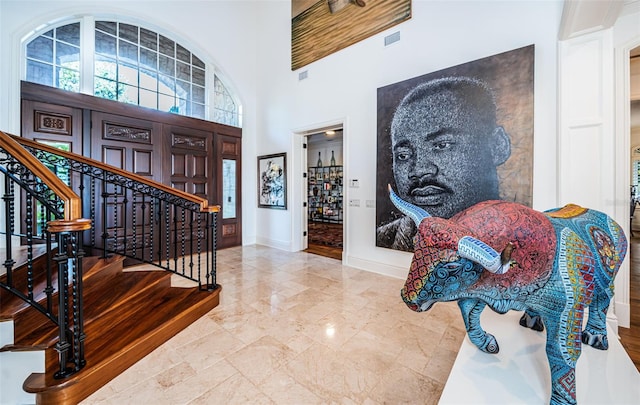 entryway with a high ceiling