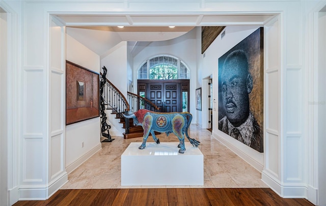 foyer entrance with light hardwood / wood-style floors