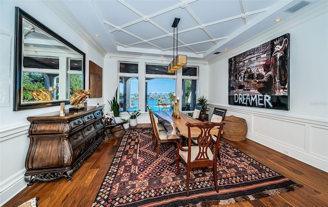 dining space featuring coffered ceiling and hardwood / wood-style flooring