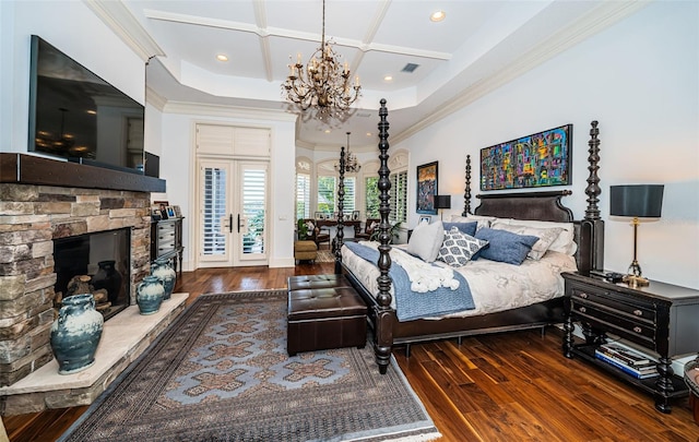 bedroom with coffered ceiling, crown molding, and dark wood-type flooring