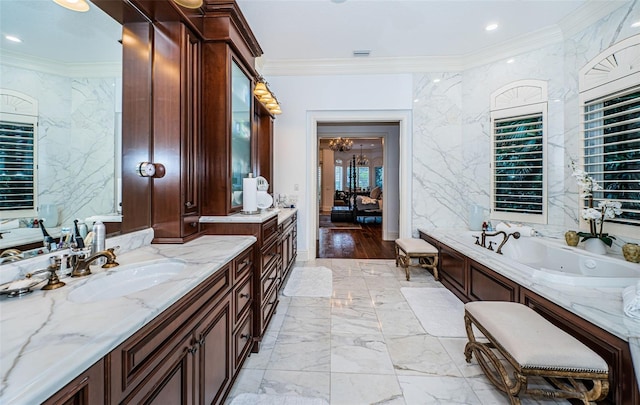 bathroom with crown molding, a bath, and vanity