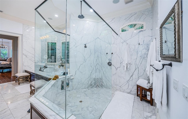 bathroom featuring a chandelier, ornamental molding, and a shower with door