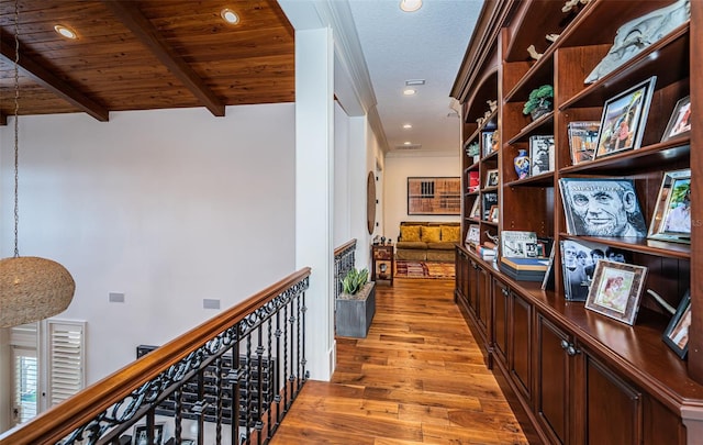 hall featuring hardwood / wood-style flooring, lofted ceiling with beams, and wood ceiling