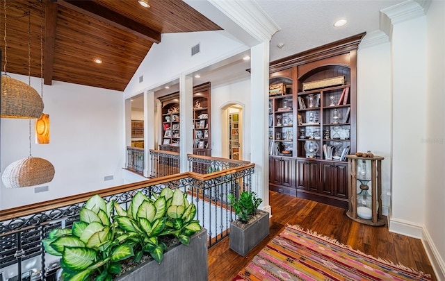 hall with wooden ceiling, dark hardwood / wood-style flooring, and lofted ceiling with beams