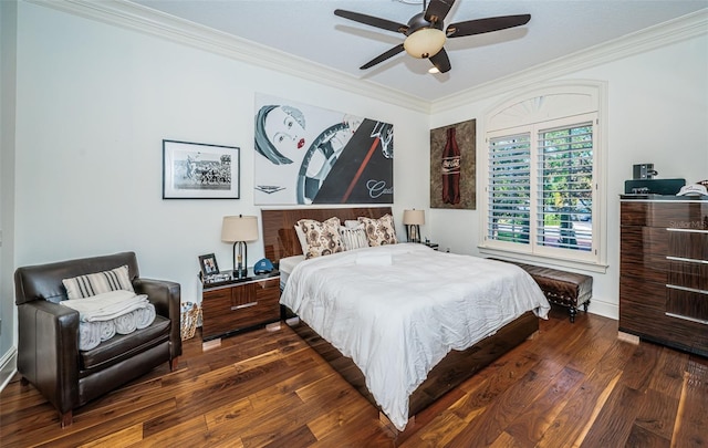 bedroom with ceiling fan, dark hardwood / wood-style floors, and crown molding