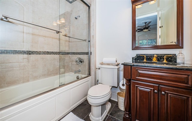 full bathroom with vanity, shower / bath combination with glass door, ceiling fan, and toilet