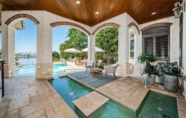 view of patio / terrace featuring a water view