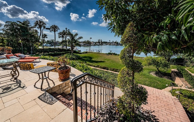 view of patio featuring a water view